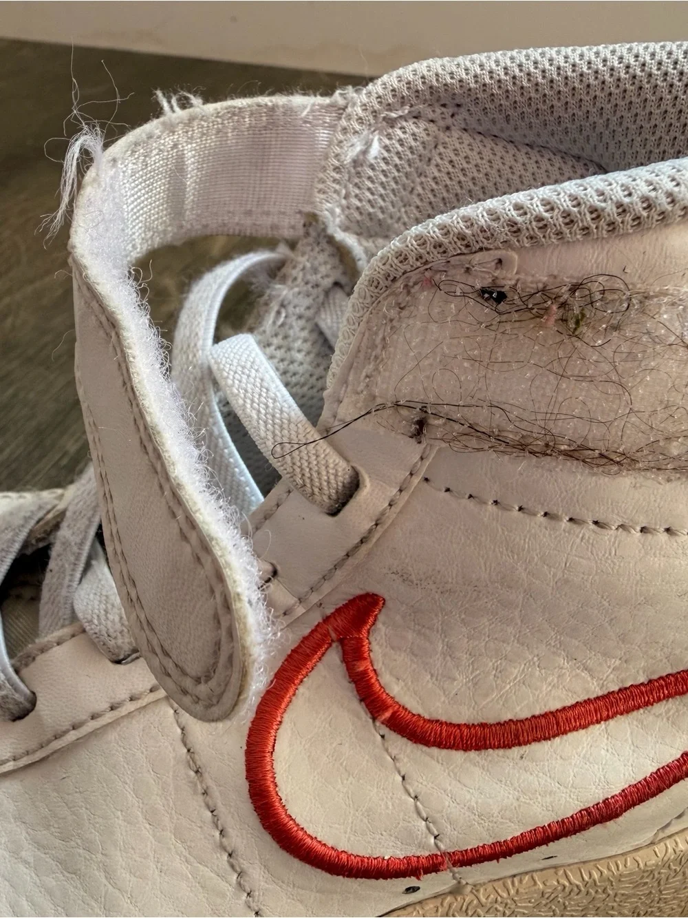 Nike Kids White High-Top Sneakers with Coral Swoosh Accent